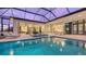 Resort-style pool and spa with covered lanai and fire pit at 19439 Beacon Park Pl, Bradenton, FL 34202
