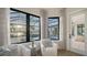 Relaxing sitting area with comfy armchairs and access to a private patio at 19439 Beacon Park Pl, Bradenton, FL 34202