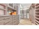 Large walk-in closet with ample shelving and drawers at 19439 Beacon Park Pl, Bradenton, FL 34202