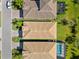 Aerial view of community homes with neighborhood streets and landscaping at 2101 6Th E St, Palmetto, FL 34221