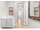 Hallway with arched openings, art, and stylish cabinets and long sight lines at 2101 6Th E St, Palmetto, FL 34221