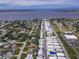 Community aerial view with waterfront access, retail shopping and tranquil tree lined streets at 2107 Palma Sola Blvd # 84, Bradenton, FL 34209