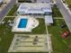 Community features pool, shuffleboard, and building at 2107 Palma Sola Blvd # 84, Bradenton, FL 34209