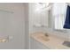 Bright bathroom with a white vanity, soft-tone countertop, and ample storage at 2107 Palma Sola Blvd # 84, Bradenton, FL 34209