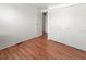 Bedroom featuring wood floors, closet, and a door to another room at 2107 Palma Sola Blvd # 84, Bradenton, FL 34209
