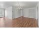 Bright dining room features hardwood floors and a chandelier at 2107 Palma Sola Blvd # 84, Bradenton, FL 34209
