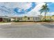 Charming single-story home featuring a covered carport and well-maintained landscaping at 2107 Palma Sola Blvd # 84, Bradenton, FL 34209