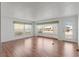 Bright living room featuring many windows for natural light and wood floors for a touch of elegance at 2107 Palma Sola Blvd # 84, Bradenton, FL 34209