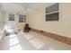 Relaxing sunroom with tile flooring, a ceiling fan, and ample natural light at 2107 Palma Sola Blvd # 84, Bradenton, FL 34209
