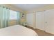 Relaxing bedroom with a double bed and a closet with paneled doors at 220 Monet Dr, Nokomis, FL 34275