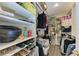 Spacious walk-in closet with shelving and ample storage for shoes, clothing, and accessories at 220 Monet Dr, Nokomis, FL 34275