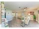 Spacious living room featuring updated flooring and modern decor, bathed in natural light from sliding glass doors at 220 Monet Dr, Nokomis, FL 34275