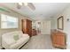 Open main bedroom with closet, ensuite bathroom, and a sitting area at 220 Monet Dr, Nokomis, FL 34275