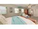 Bright main bedroom with natural light, ceiling fan, and access to the ensuite bathroom at 220 Monet Dr, Nokomis, FL 34275