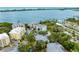 A beautiful aerial view of a waterfront condo community with boat docks and lush landscaping at 232 Hidden Bay Dr # 504, Osprey, FL 34229