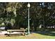 Relaxing park bench under the shade of trees at 2658 Prospect St, Sarasota, FL 34239