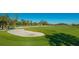 Landscaped golf course with lush greens and sand traps at 27475 Janzen Ct, Englewood, FL 34223