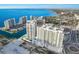 Aerial view of a luxury waterfront community with high-rise buildings at 301 Quay Commons # 1111, Sarasota, FL 34236