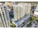 Aerial view of a modern highrise building in a city setting at 301 Quay Commons # 1111, Sarasota, FL 34236
