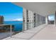 Private balcony with glass railings and amazing water views at 301 Quay Commons # 1111, Sarasota, FL 34236