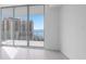 Bedroom with floor to ceiling windows and water views at 301 Quay Commons # 1111, Sarasota, FL 34236