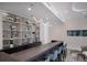 Stylish community bar with sleek design and modern shelving at 301 Quay Commons # 1111, Sarasota, FL 34236