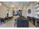 Modern community lounge with comfortable seating, a large TV, and a stylish bar at 301 Quay Commons # 1111, Sarasota, FL 34236