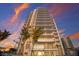 Stunning building exterior at sunset at 301 Quay Commons # 1111, Sarasota, FL 34236