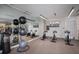 Fitness center with cardio equipment and large screen TV at 301 Quay Commons # 1111, Sarasota, FL 34236