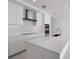 Contemporary kitchen featuring white countertops and stainless steel appliances at 301 Quay Commons # 1111, Sarasota, FL 34236