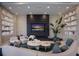 Modern lobby with large TV, comfortable seating, and a fireplace at 301 Quay Commons # 1111, Sarasota, FL 34236