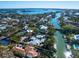 Bird's-eye view of the property and surrounding area, highlighting waterfront location and canal access at 3460 Flamingo Ave, Sarasota, FL 34242