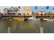 Colorful waterfront shops and boats at the marina at 3460 Flamingo Ave, Sarasota, FL 34242