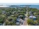Aerial view showing a house and surrounding neighborhood near the water at 3511 Camino Real, Sarasota, FL 34239