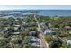 Aerial view showing a house and surrounding neighborhood near the water at 3511 Camino Real, Sarasota, FL 34239