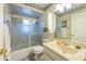 Bathroom features a shower/tub, vanity, and linen storage at 3511 Camino Real, Sarasota, FL 34239