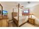 Bedroom with a wooden four-poster bed and chest of drawers at 3511 Camino Real, Sarasota, FL 34239