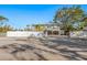 Two-story house with a gated driveway at 3511 Camino Real, Sarasota, FL 34239