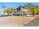 House exterior with screened porch and stairs at 3511 Camino Real, Sarasota, FL 34239