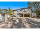 Two-story house with carport and fenced yard at 3511 Camino Real, Sarasota, FL 34239