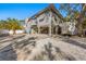 Two-story house with carport and spacious driveway at 3511 Camino Real, Sarasota, FL 34239