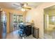 Kitchen features breakfast bar, stainless steel appliances, and access to a patio at 3511 Camino Real, Sarasota, FL 34239