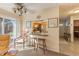 Kitchen with breakfast bar, view into living room, and window at 3511 Camino Real, Sarasota, FL 34239