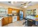 Kitchen with wood cabinets and stainless steel appliances at 3511 Camino Real, Sarasota, FL 34239