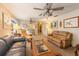 Spacious living room with leather sofas and wooden coffee table at 3511 Camino Real, Sarasota, FL 34239