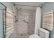 Walk-in shower with marble tile and grab bars for accessibility at 4119 61St Avenue W Ter # 105, Bradenton, FL 34210