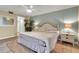Spacious bedroom with king bed, neutral decor, and ample natural light at 4119 61St Avenue W Ter # 105, Bradenton, FL 34210