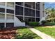Well-maintained building exterior with landscaped grounds and walkways at 4119 61St Avenue W Ter # 105, Bradenton, FL 34210