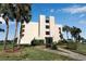 Condo building exterior with landscaping and a walkway at 4119 61St Avenue W Ter # 105, Bradenton, FL 34210