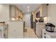 Modern kitchen with updated cabinetry, stainless steel appliances, and granite countertops at 4119 61St Avenue W Ter # 105, Bradenton, FL 34210